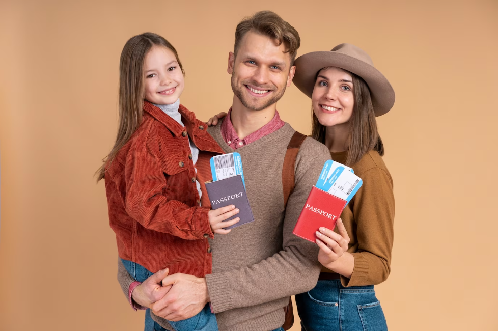 A family of three holding passports