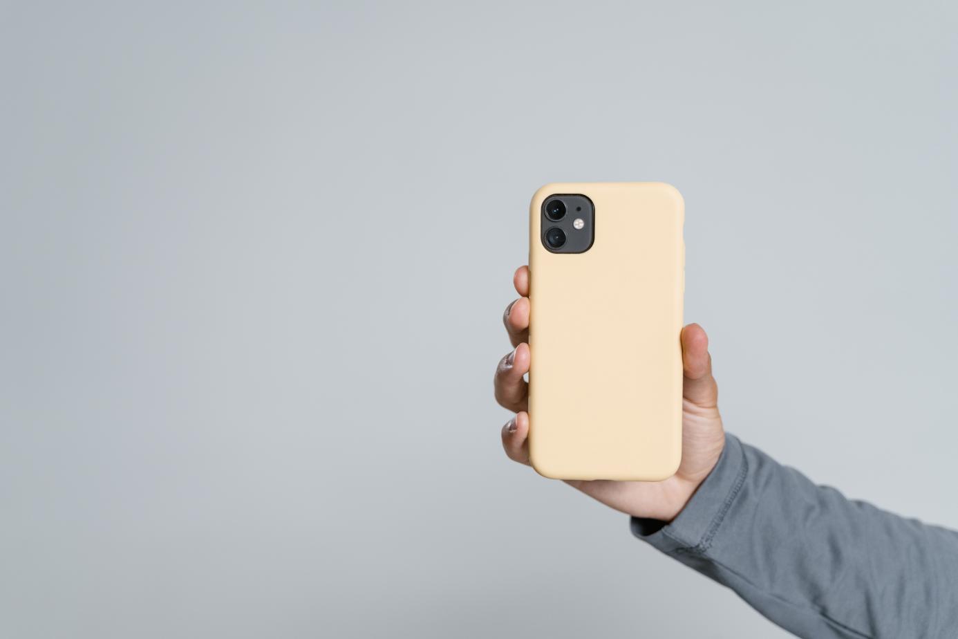 a cellphone with a yellow phone case