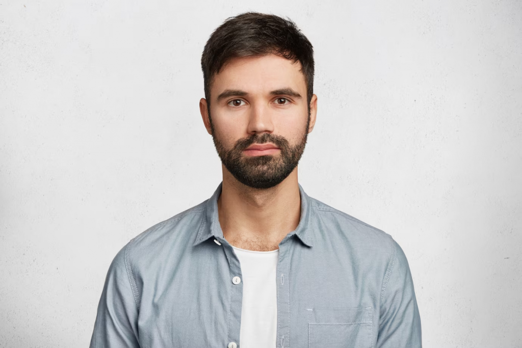 bearded young man wearing shirt