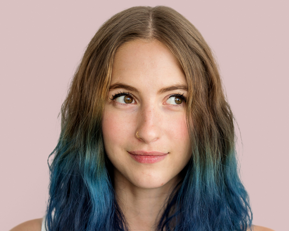 stylish young woman, smiling face portrait with blue hair