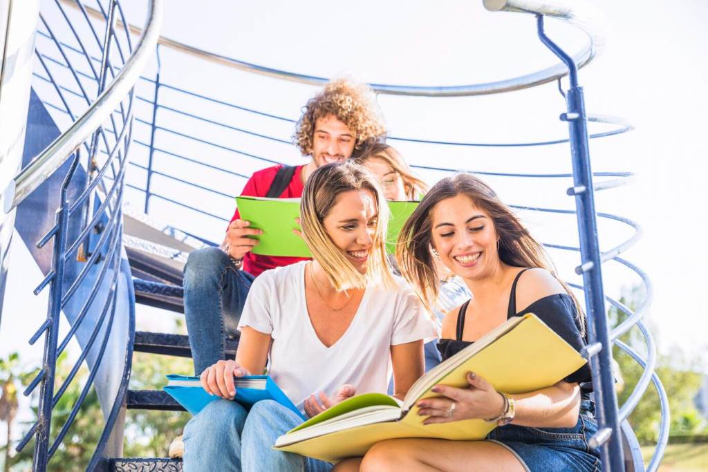 ladies studying on staircase near friends