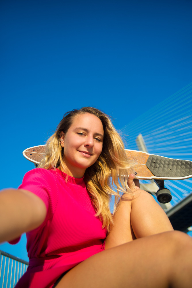 a woman holding a skateboard