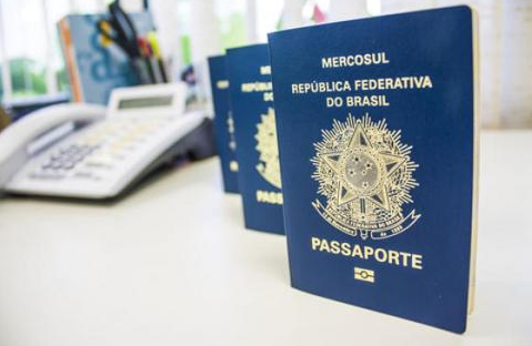 Several blue passports on a desk